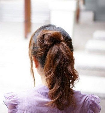 2011瘦脸的发型-散发浪漫气息的花苞头